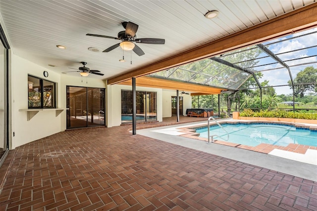 707 Warren Rd, Lutz, FL 33548 - outdoor pool featuring a jacuzzi, ceiling fan, a patio area, and glass enclosure