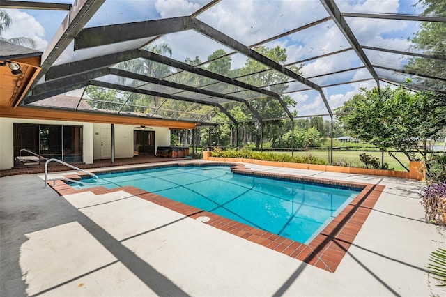 707 Warren Rd, Lutz, FL 33548 - swimming pool featuring a patio area, a ceiling fan, and a lanai