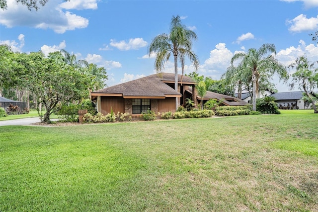 707 Warren Rd, Lutz, FL 33548 - view of front of property with a front yard