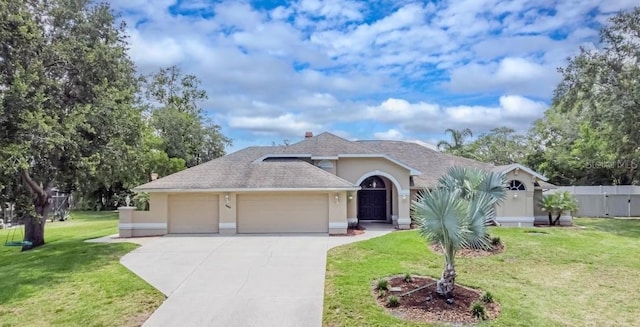 382 Florian Way, Spring Hill, FL 34609 - ranch-style home with a garage, stucco siding, driveway, and a shingled roof