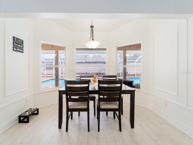 382 Florian Way, Spring Hill, FL 34609 - dining space with light wood finished floors, plenty of natural light, and baseboards