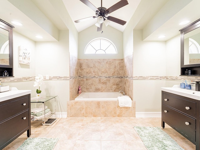 382 Florian Way, Spring Hill, FL 34609 - bathroom with vanity, a garden tub, ceiling fan, tile patterned floors, and vaulted ceiling