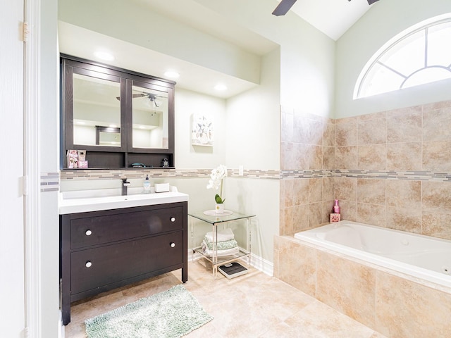 382 Florian Way, Spring Hill, FL 34609 - full bathroom featuring ceiling fan, a garden tub, vanity, tile patterned floors, and vaulted ceiling