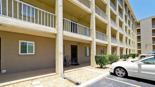 3534 Lake Bayshore Dr Unit 118, Bradenton, FL 34205 - view of apartment building / complex featuring uncovered parking