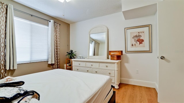3534 Lake Bayshore Dr Unit 118, Bradenton, FL 34205 - bedroom featuring light wood-style flooring and baseboards