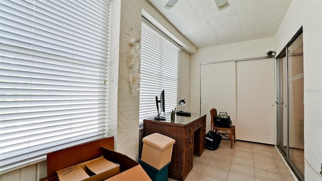 3534 Lake Bayshore Dr Unit 118, Bradenton, FL 34205 - office area featuring light tile patterned floors, a textured ceiling, and healthy amount of natural light