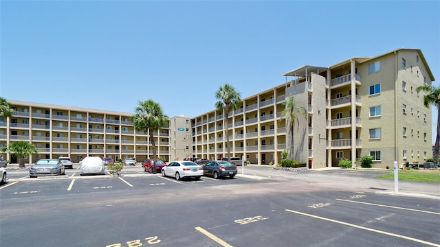 3534 Lake Bayshore Dr Unit 118, Bradenton, FL 34205 - view of apartment building / complex with uncovered parking and central AC unit