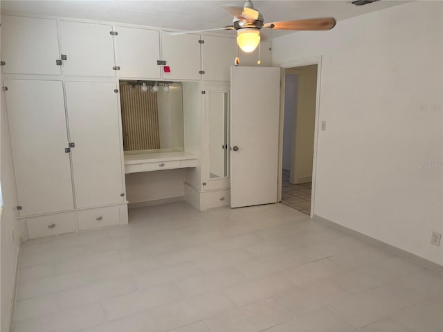 5008 N Suwanee Ave, Tampa, FL 33603 - unfurnished bedroom featuring baseboards and a ceiling fan