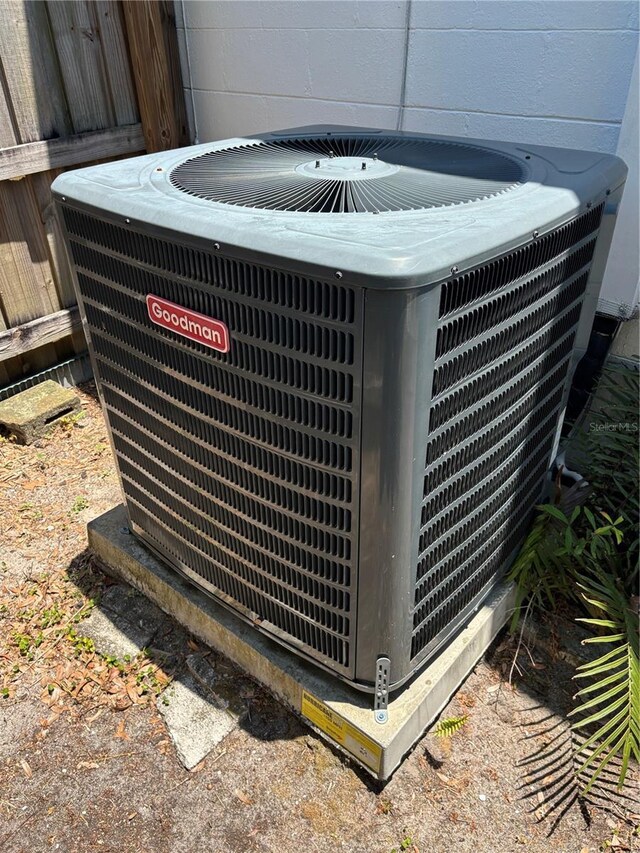 5008 N Suwanee Ave, Tampa, FL 33603 - exterior view of central AC unit and concrete block siding