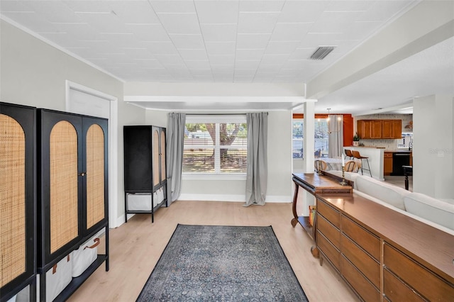 504 7th Ave SW, Largo, FL 33770 - living room featuring light wood-type flooring and baseboards