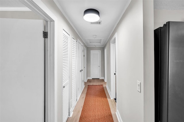 504 7th Ave SW, Largo, FL 33770 - corridor with baseboards and light wood-type flooring