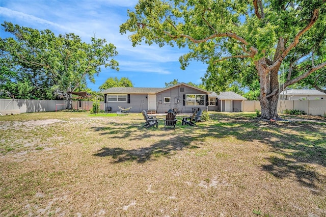 504 7th Ave SW, Largo, FL 33770 - rear view of property with a fire pit
