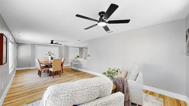 829 Riverside Dr, Tarpon Springs, FL 34689 - dining space with a ceiling fan, baseboards, light wood-style floors, and recessed lighting