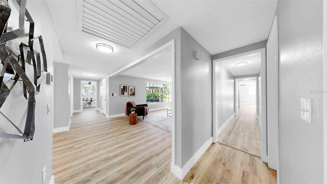 829 Riverside Dr, Tarpon Springs, FL 34689 - hall with light wood-style floors and baseboards
