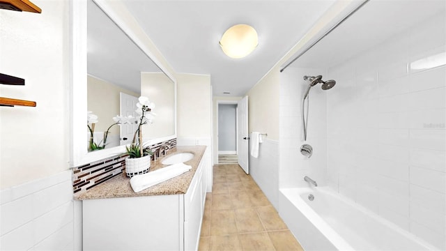 829 Riverside Dr, Tarpon Springs, FL 34689 - full bath with vanity, tile patterned flooring, and shower / bath combination