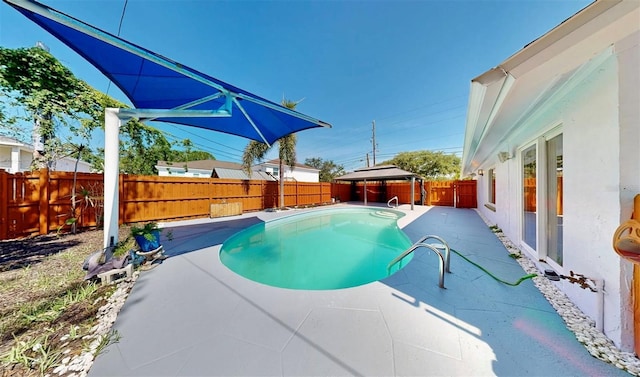 829 Riverside Dr, Tarpon Springs, FL 34689 - view of pool with a gazebo, a fenced backyard, and a patio