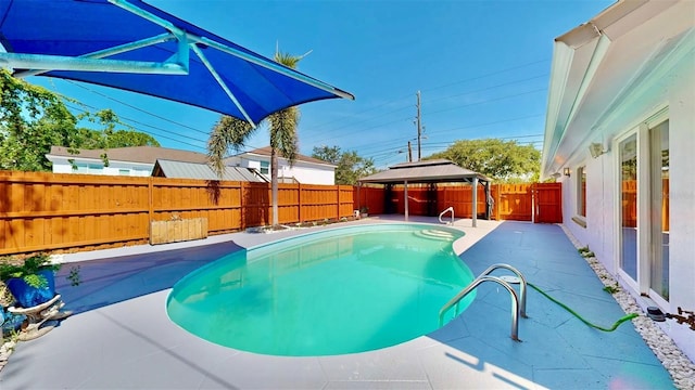 829 Riverside Dr, Tarpon Springs, FL 34689 - view of pool featuring a gazebo, a patio area, and a fenced backyard