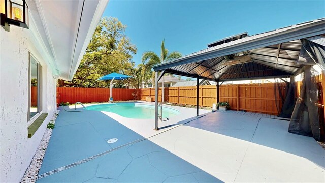 829 Riverside Dr, Tarpon Springs, FL 34689 - fenced backyard featuring a gazebo and a patio area