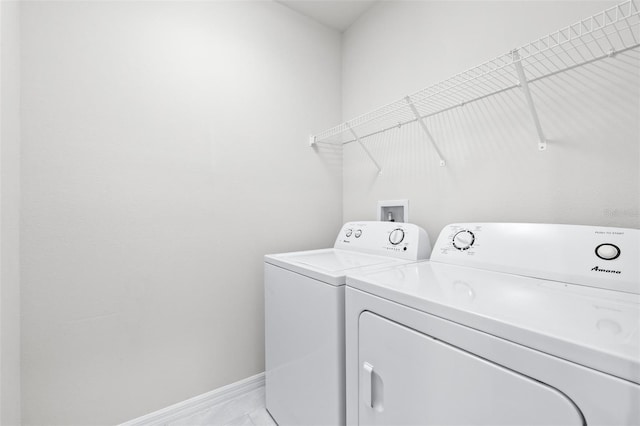 6563 Ryestone Way, Wesley Chapel, FL 33545 - laundry area featuring washing machine and dryer and baseboards