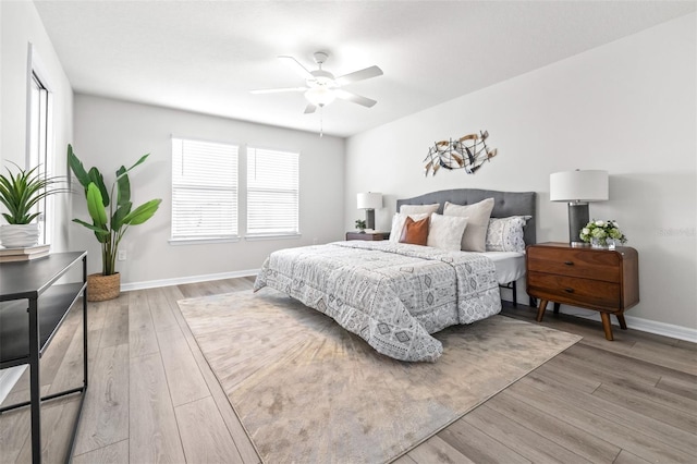 6563 Ryestone Way, Wesley Chapel, FL 33545 - bedroom with wood finished floors, baseboards, and a ceiling fan