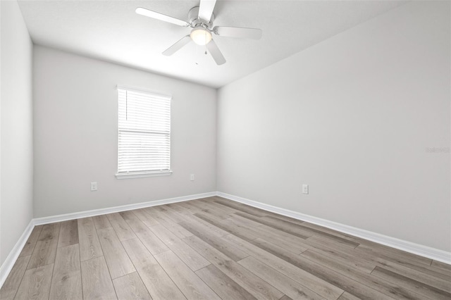 6563 Ryestone Way, Wesley Chapel, FL 33545 - unfurnished room featuring light wood-style floors, baseboards, and a ceiling fan