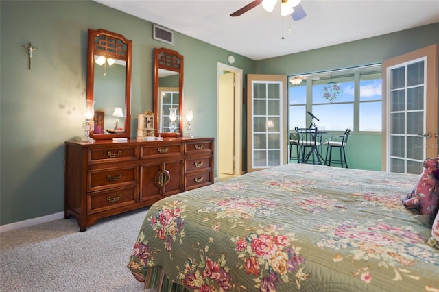 4550 Cove Cir Unit 1003, Saint Petersburg, FL 33708 - bedroom with light carpet, baseboards, and a ceiling fan