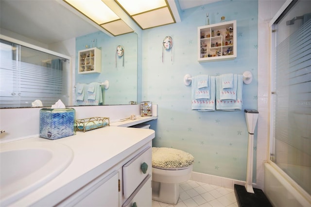 4550 Cove Cir Unit 1003, Saint Petersburg, FL 33708 - full bathroom featuring vanity, toilet, tile patterned floors, and shower / bath combination with glass door