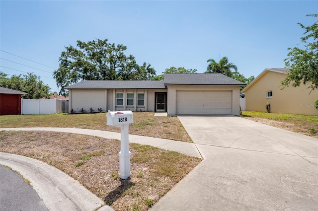 1818 Willow Oak Dr, Palm Harbor, FL 34683 - ranch-style home featuring a garage, driveway, and stucco siding