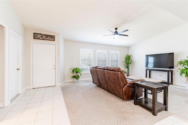 1818 Willow Oak Dr, Palm Harbor, FL 34683 - living area with ceiling fan, light tile patterned floors, and baseboards