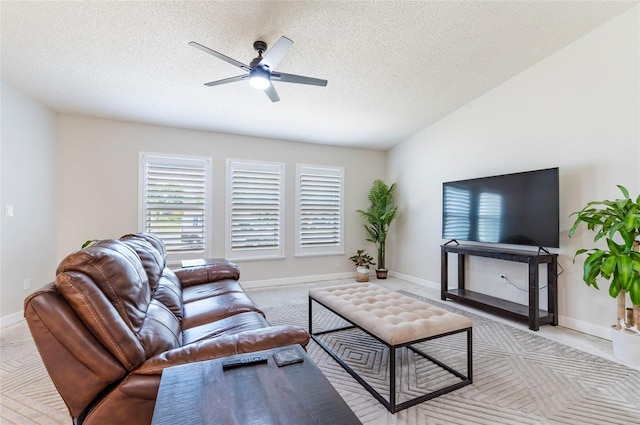 1818 Willow Oak Dr, Palm Harbor, FL 34683 - living room with a ceiling fan, a textured ceiling, baseboards, and light carpet