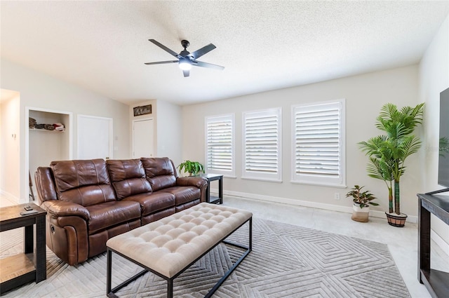 1818 Willow Oak Dr, Palm Harbor, FL 34683 - living area featuring a ceiling fan, baseboards, and light carpet