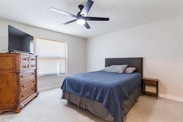 1818 Willow Oak Dr, Palm Harbor, FL 34683 - bedroom with light carpet, baseboards, ceiling fan, and a textured ceiling