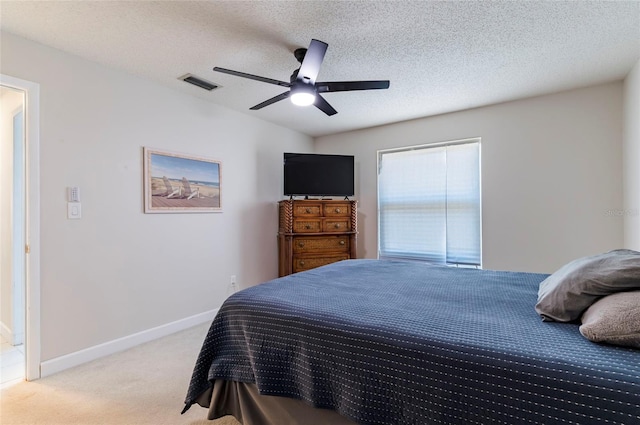 1818 Willow Oak Dr, Palm Harbor, FL 34683 - bedroom with light colored carpet, a ceiling fan, baseboards, and a textured ceiling