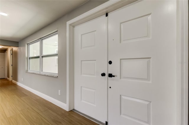 10744 Drummond Rd, Tampa, FL 33615 - entryway with baseboards and light wood-style flooring