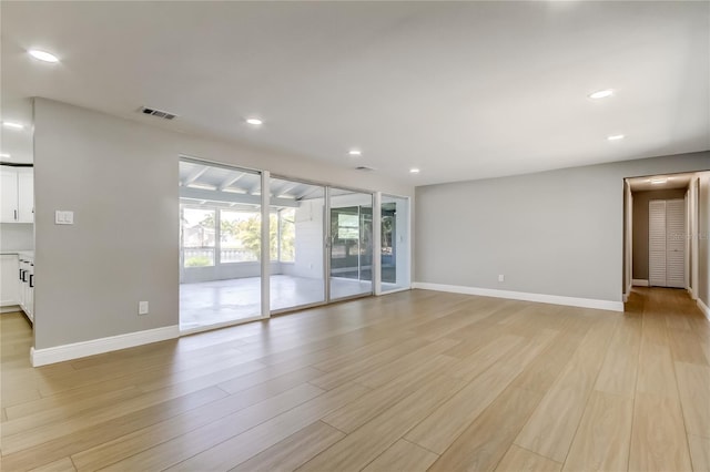 10744 Drummond Rd, Tampa, FL 33615 - unfurnished room featuring baseboards, light wood-style flooring, and recessed lighting