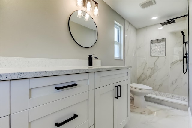 10744 Drummond Rd, Tampa, FL 33615 - full bath with marble look tiles, vanity, toilet, a marble finish shower, and recessed lighting