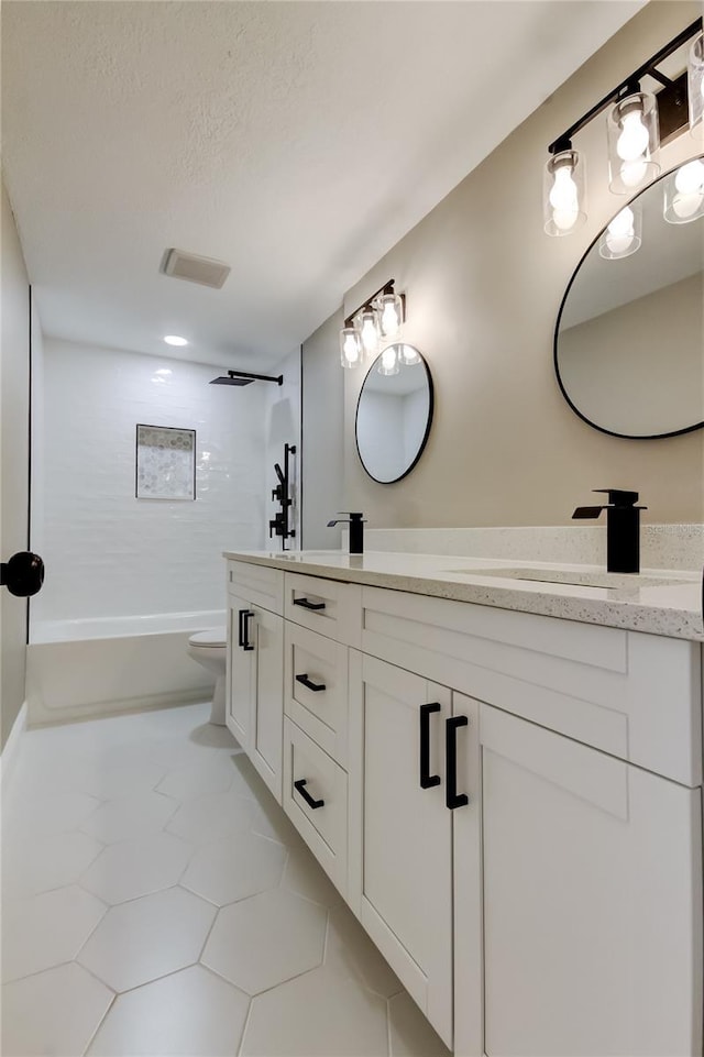 10744 Drummond Rd, Tampa, FL 33615 - bathroom featuring double vanity, toilet, tub / shower combination, tile patterned flooring, and a textured ceiling