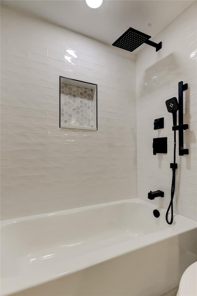 10744 Drummond Rd, Tampa, FL 33615 - full bathroom featuring washtub / shower combination and toilet