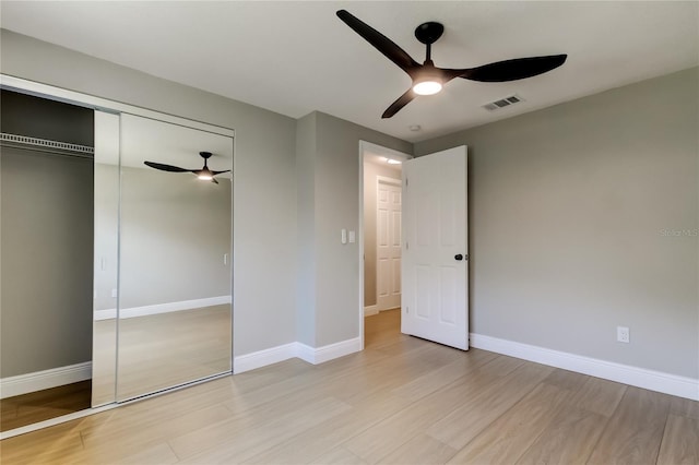 10744 Drummond Rd, Tampa, FL 33615 - unfurnished bedroom with light wood finished floors, a closet, and baseboards