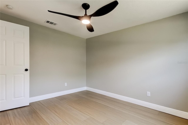10744 Drummond Rd, Tampa, FL 33615 - spare room with light wood-style flooring, ceiling fan, and baseboards