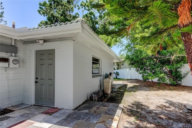 10744 Drummond Rd, Tampa, FL 33615 - view of exterior entry with a tile roof