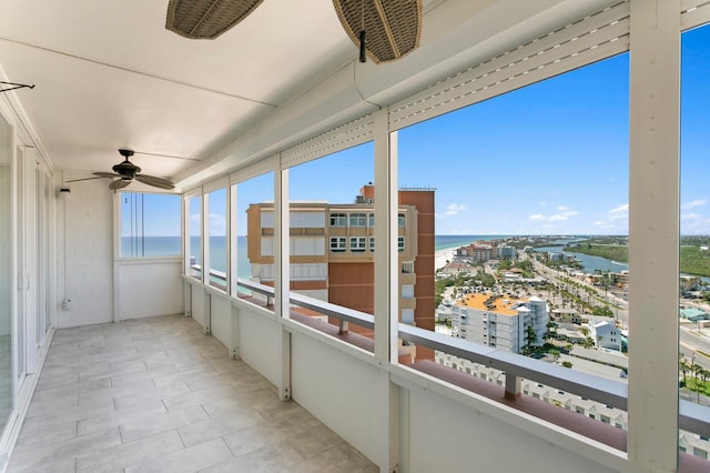 17920 Gulf Blvd Unit 1806, Redington Shores, FL 33708 - unfurnished sunroom with a water view and ceiling fan