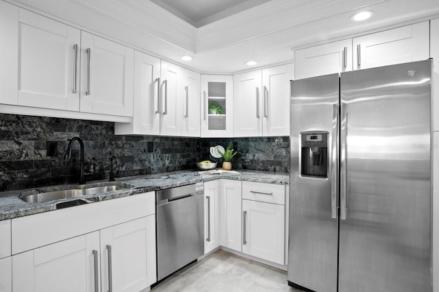 17920 Gulf Blvd Unit 1806, Redington Shores, FL 33708 - kitchen featuring appliances with stainless steel finishes, a sink, decorative backsplash, white cabinets, and recessed lighting