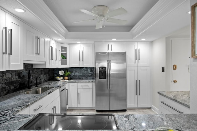 17920 Gulf Blvd Unit 1806, Redington Shores, FL 33708 - kitchen with stainless steel appliances, a sink, a raised ceiling, white cabinetry, and recessed lighting