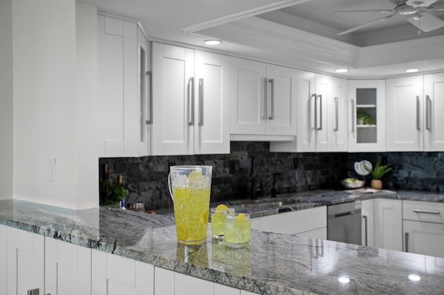 17920 Gulf Blvd Unit 1806, Redington Shores, FL 33708 - kitchen featuring white cabinets, stone countertops, ceiling fan, a tray ceiling, and dishwasher