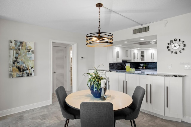 17920 Gulf Blvd Unit 1806, Redington Shores, FL 33708 - dining area with baseboards, a chandelier, and recessed lighting