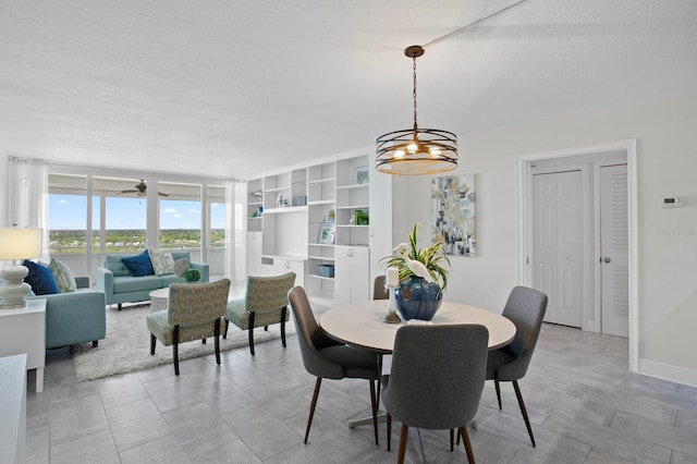 17920 Gulf Blvd Unit 1806, Redington Shores, FL 33708 - dining room with a chandelier and a textured ceiling