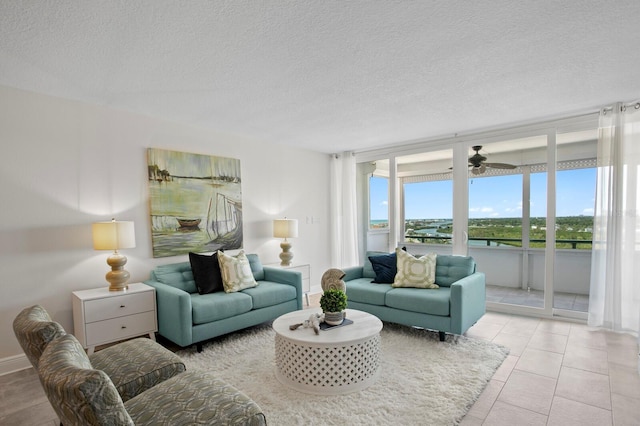 17920 Gulf Blvd Unit 1806, Redington Shores, FL 33708 - living room with a textured ceiling and ceiling fan