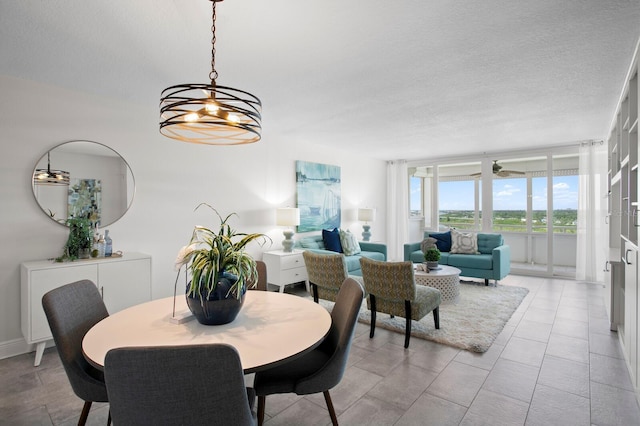 17920 Gulf Blvd Unit 1806, Redington Shores, FL 33708 - dining room featuring a textured ceiling and a chandelier