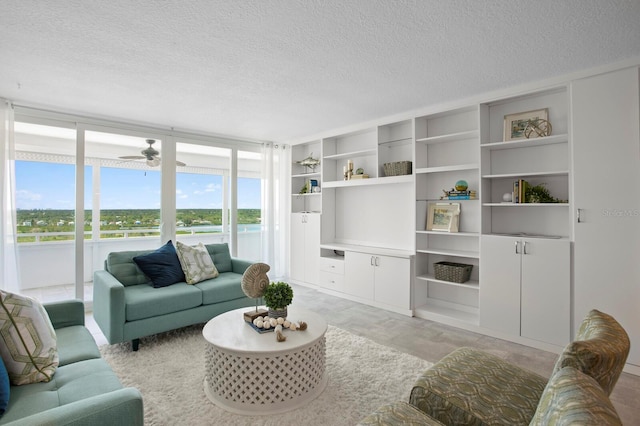 17920 Gulf Blvd Unit 1806, Redington Shores, FL 33708 - living room with a textured ceiling, light wood-style floors, ceiling fan, and built in features